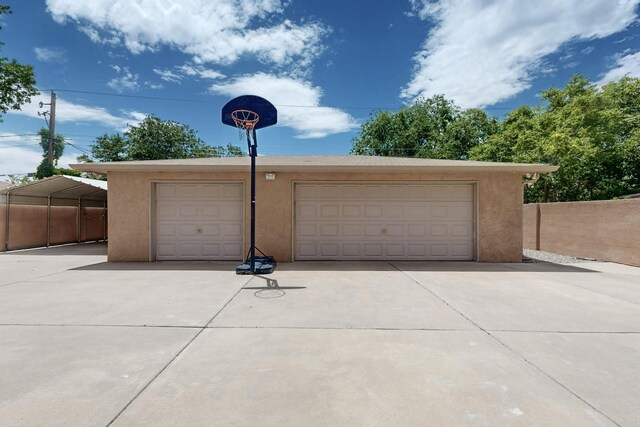 2517 Georgene Dr NE, Albuquerque, NM 87112 - unfurnished living room featuring a ceiling fan, baseboard heating, wood finished floors, a glass covered fireplace, and a high ceiling