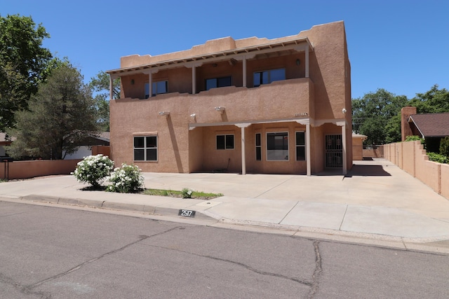 2517 Georgene Dr NE, Albuquerque, NM 87112 - view of front of property with stucco siding and a balcony