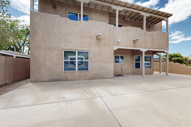 2517 Georgene Dr NE, Albuquerque, NM 87112 - rear view of house featuring stucco siding and a patio
