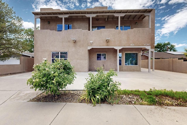 2517 Georgene Dr NE, Albuquerque, NM 87112 - back of property with stucco siding and a patio