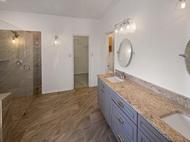 1713 Caramesa Dr SE, Rio Rancho, NM 87124 - full bathroom featuring a stall shower, a walk in closet, and double vanity