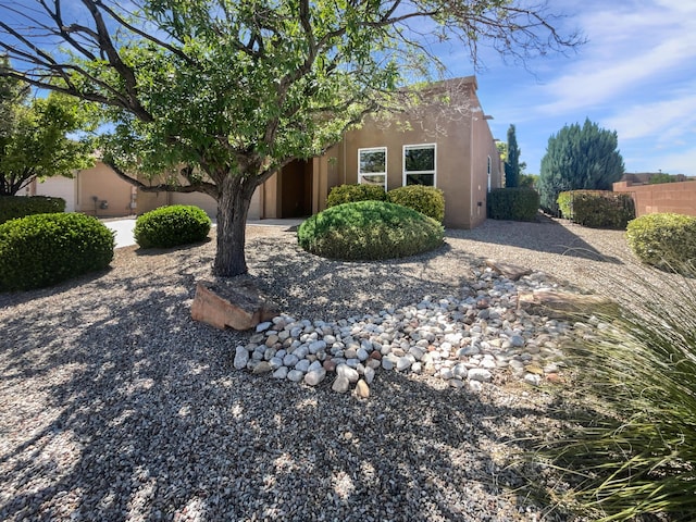 1713 Caramesa Dr SE, Rio Rancho, NM 87124 - pueblo revival-style home featuring stucco siding