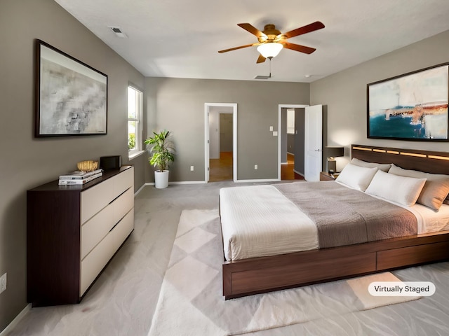 1713 Caramesa Dr SE, Rio Rancho, NM 87124 - bedroom with light carpet, baseboards, and a ceiling fan