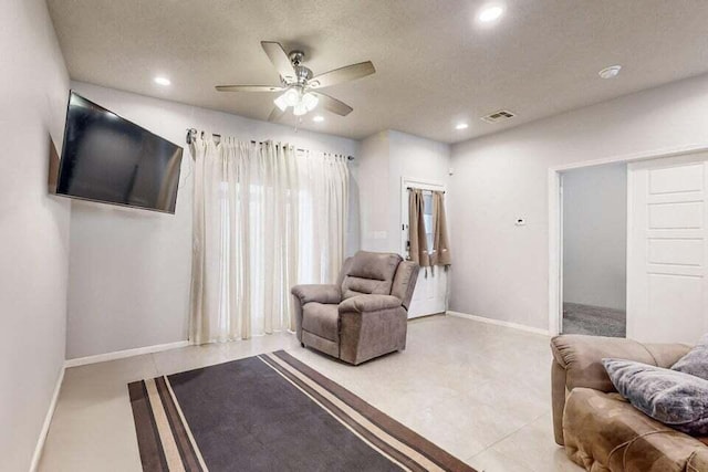 1472 Tierra Verde Loop, Los Lunas, NM 87031 - living area with ceiling fan, recessed lighting, baseboards, and a textured ceiling
