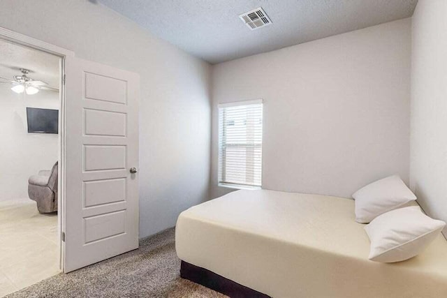 1472 Tierra Verde Loop, Los Lunas, NM 87031 - carpeted bedroom with a textured ceiling