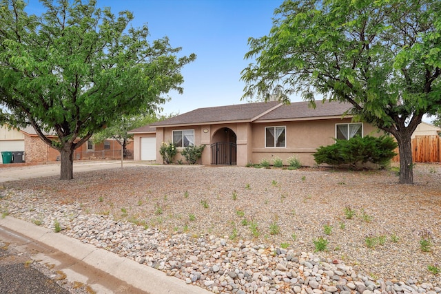 4235 Pumice Dr NE, Rio Rancho, NM 87124 - ranch-style house with an attached garage and stucco siding