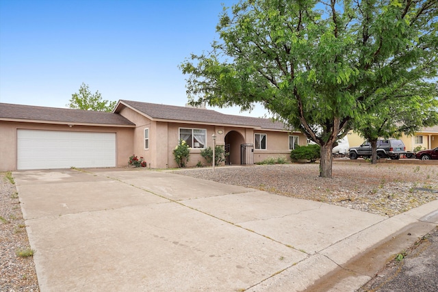 4235 Pumice Dr NE, Rio Rancho, NM 87124 - ranch-style home featuring driveway, an attached garage, and stucco siding