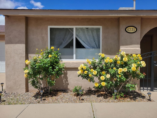 4235 Pumice Dr NE, Rio Rancho, NM 87124 - view of property exterior with stucco siding