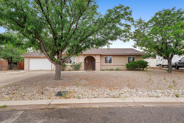 4235 Pumice Dr NE, Rio Rancho, NM 87124 - view of front of home with concrete driveway and stucco siding