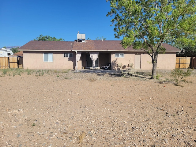 4235 Pumice Dr NE, Rio Rancho, NM 87124 - back of house with stucco siding