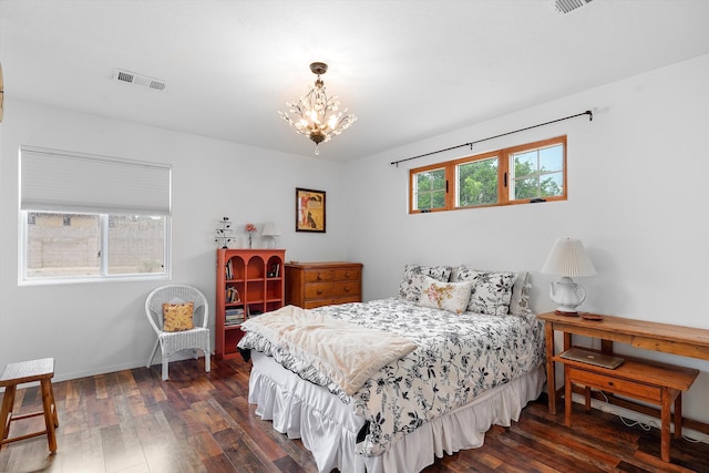 4235 Pumice Dr NE, Rio Rancho, NM 87124 - bedroom featuring dark wood-style floors, a chandelier, and baseboards