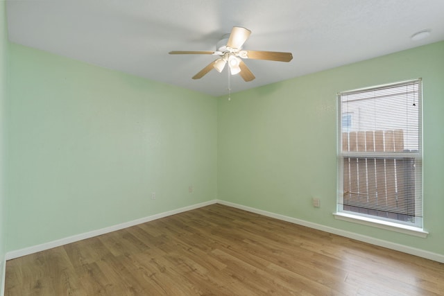 9200 Saguaro St NW, Albuquerque, NM 87114 - spare room with wood finished floors, baseboards, and ceiling fan