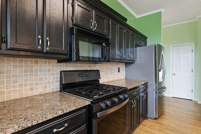 9200 Saguaro St NW, Albuquerque, NM 87114 - kitchen featuring appliances with stainless steel finishes, ornamental molding, light wood finished floors, decorative backsplash, and stone counters