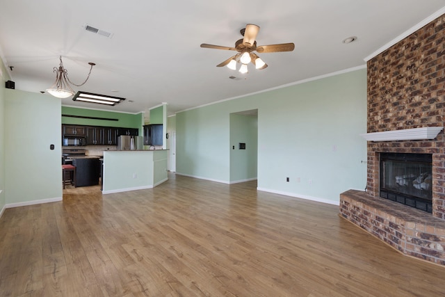 9200 Saguaro St NW, Albuquerque, NM 87114 - unfurnished living room with ceiling fan, light wood-type flooring, a brick fireplace, ornamental molding, and baseboards
