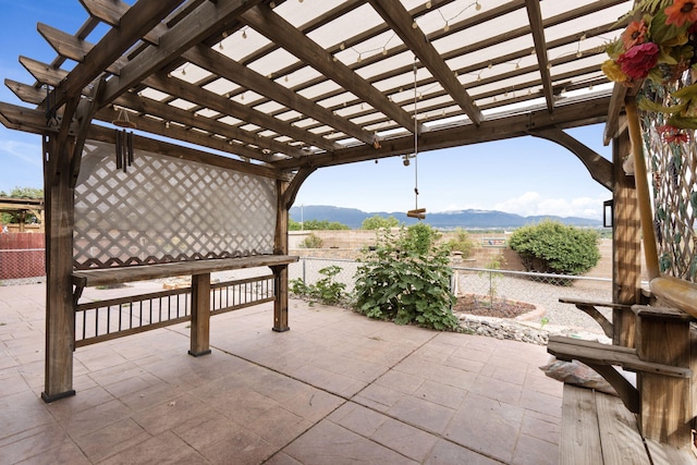 9200 Saguaro St NW, Albuquerque, NM 87114 - view of patio / terrace featuring a mountain view and a pergola