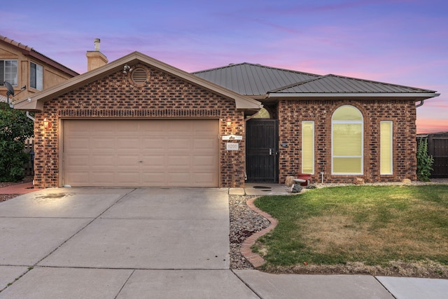 9200 Saguaro St NW, Albuquerque, NM 87114 - ranch-style house with driveway, brick siding, a garage, a lawn, and metal roof