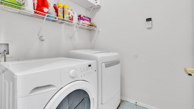 1023 Marapi St NW, Albuquerque, NM 87120 - washroom with washing machine and clothes dryer and baseboards