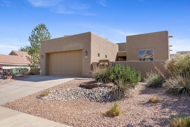 4612 Cactus Ave NW, Albuquerque, NM 87114 - adobe home featuring stucco siding, driveway, and an attached garage