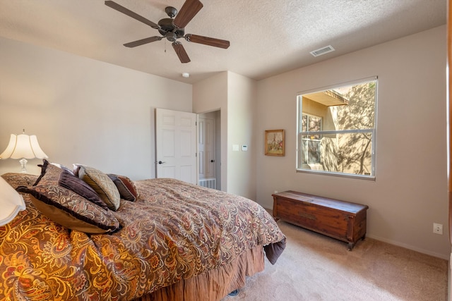 4612 Cactus Ave NW, Albuquerque, NM 87114 - bedroom with light carpet, ceiling fan, and a textured ceiling