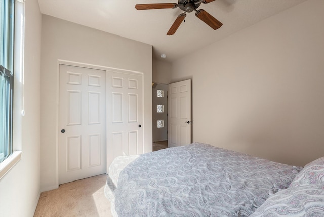 4612 Cactus Ave NW, Albuquerque, NM 87114 - bedroom with light carpet, a closet, and ceiling fan