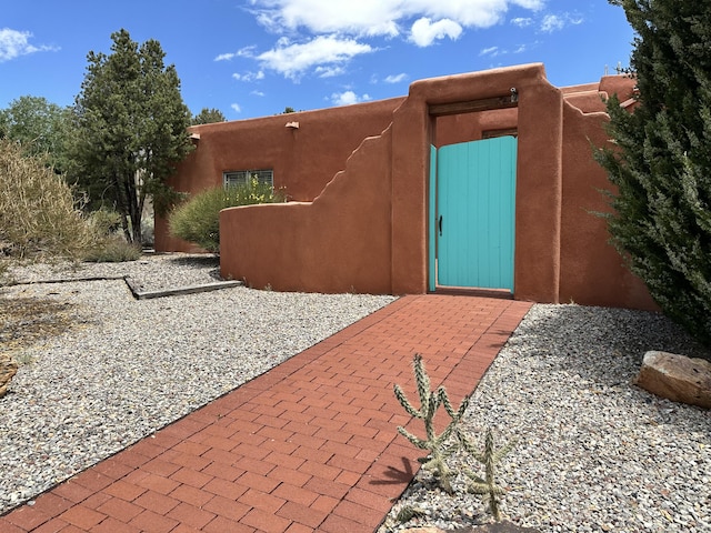 1704 Quail Run Ct NE, Albuquerque, NM 87122 - view of exterior entry featuring stucco siding