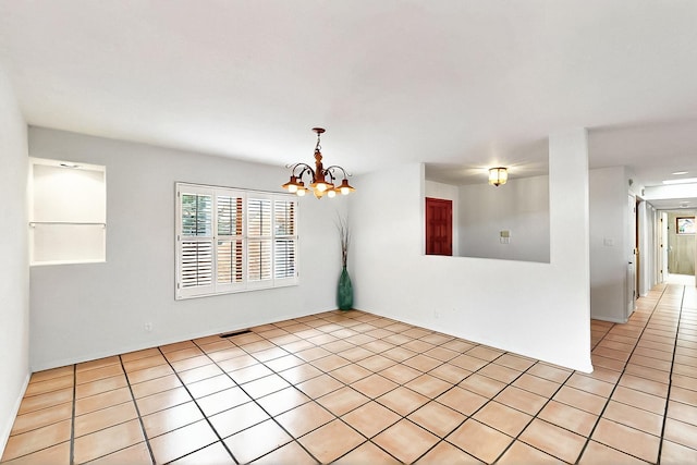 1704 Quail Run Ct NE, Albuquerque, NM 87122 - spare room featuring light tile patterned floors and a chandelier