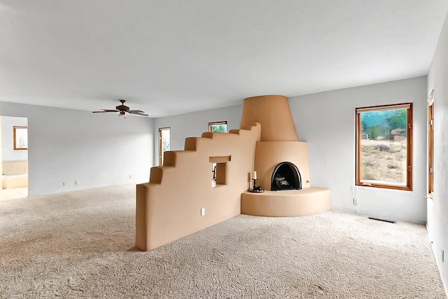 1704 Quail Run Ct NE, Albuquerque, NM 87122 - unfurnished living room featuring carpet floors and a ceiling fan