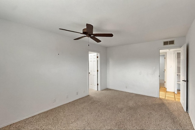 1704 Quail Run Ct NE, Albuquerque, NM 87122 - unfurnished bedroom with light carpet, a ceiling fan, and baseboards