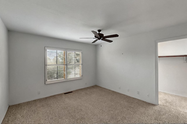 1704 Quail Run Ct NE, Albuquerque, NM 87122 - unfurnished bedroom with carpet flooring, a walk in closet, ceiling fan, and a closet