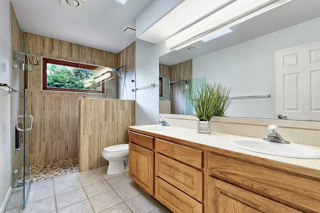 1704 Quail Run Ct NE, Albuquerque, NM 87122 - full bath featuring a shower stall, tile patterned flooring, toilet, and double vanity