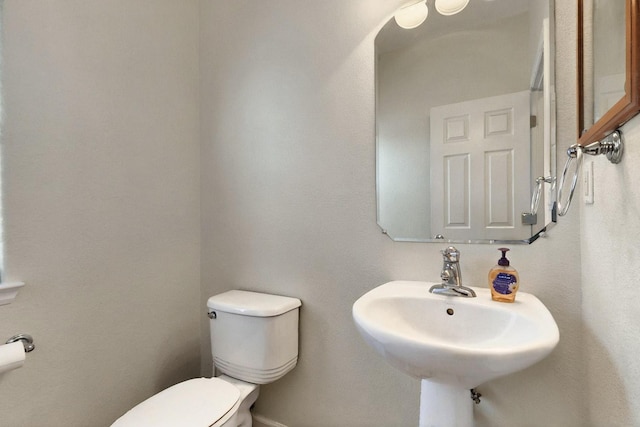 1412 Wind Ridge Dr NW, Albuquerque, NM 87120 - bathroom featuring toilet and a sink