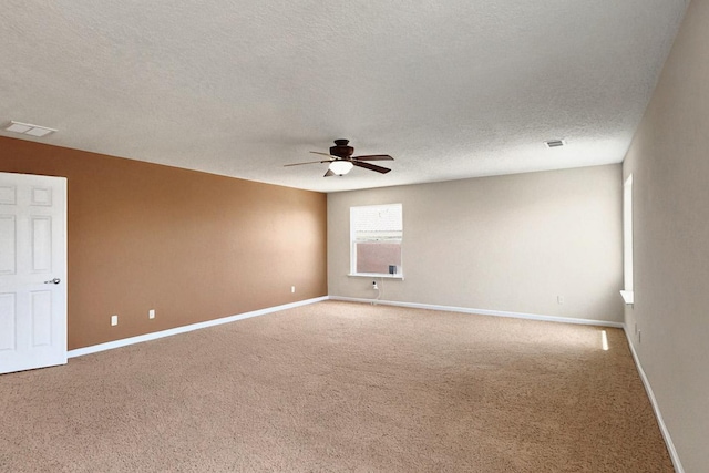 1412 Wind Ridge Dr NW, Albuquerque, NM 87120 - spare room featuring a ceiling fan, a textured ceiling, and carpet floors