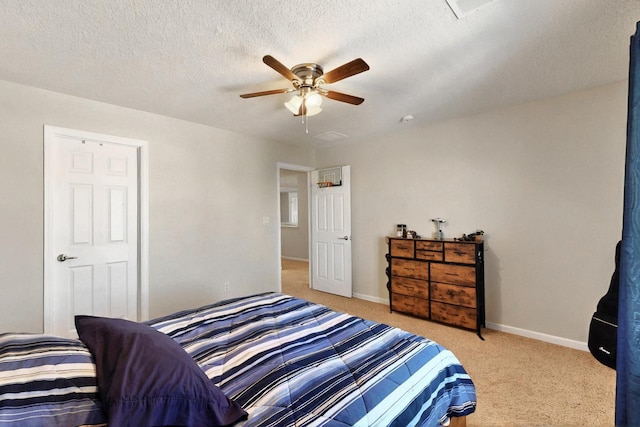 1412 Wind Ridge Dr NW, Albuquerque, NM 87120 - bedroom featuring light carpet, ceiling fan, and a textured ceiling