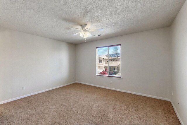 1412 Wind Ridge Dr NW, Albuquerque, NM 87120 - spare room with carpet floors, ceiling fan, and a textured ceiling