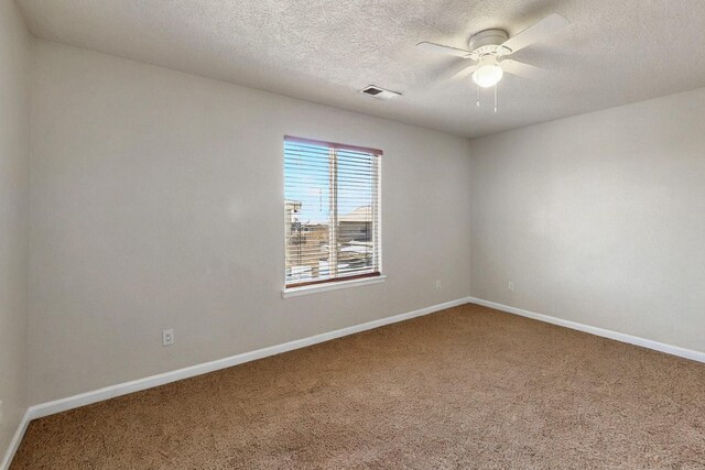 1412 Wind Ridge Dr NW, Albuquerque, NM 87120 - carpeted empty room with ceiling fan and a textured ceiling