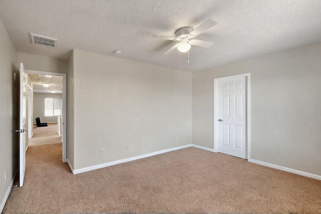 1412 Wind Ridge Dr NW, Albuquerque, NM 87120 - unfurnished bedroom with carpet, a textured ceiling, and a ceiling fan