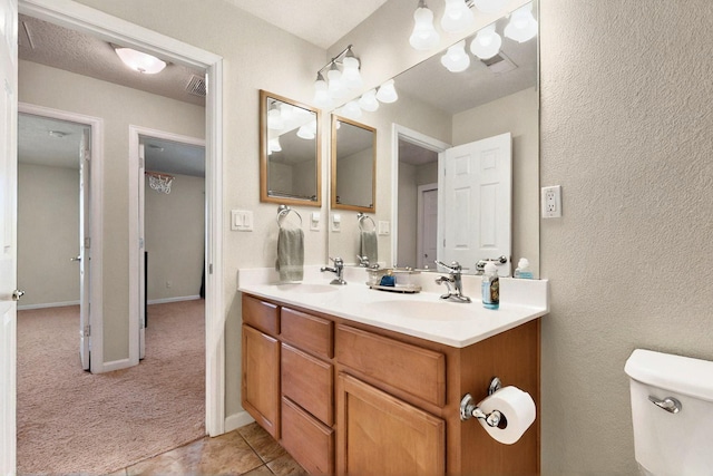 1412 Wind Ridge Dr NW, Albuquerque, NM 87120 - bathroom with double vanity and tile patterned floors