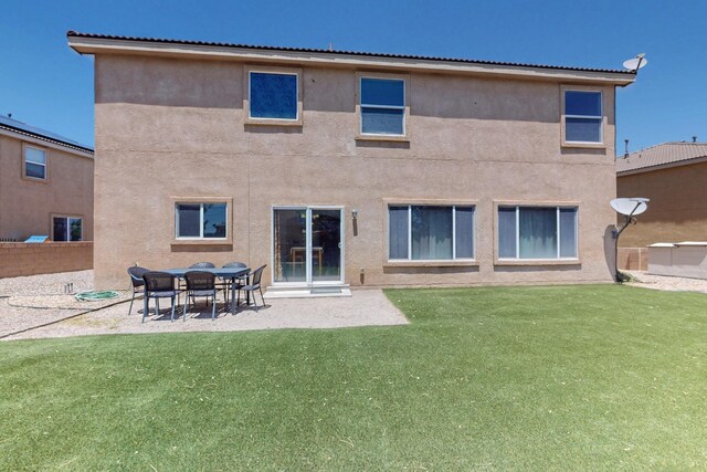 1412 Wind Ridge Dr NW, Albuquerque, NM 87120 - rear view of property with stucco siding and a patio