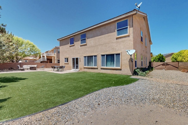 1412 Wind Ridge Dr NW, Albuquerque, NM 87120 - back of property with a patio area, a fenced backyard, and stucco siding