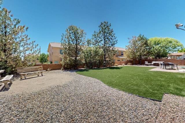 1412 Wind Ridge Dr NW, Albuquerque, NM 87120 - fenced backyard featuring a patio area