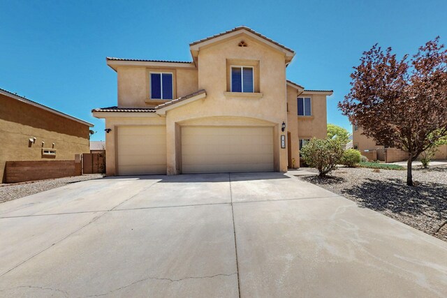 1412 Wind Ridge Dr NW, Albuquerque, NM 87120 - view of front of property with stucco siding, an attached garage, concrete driveway, and a tile roof