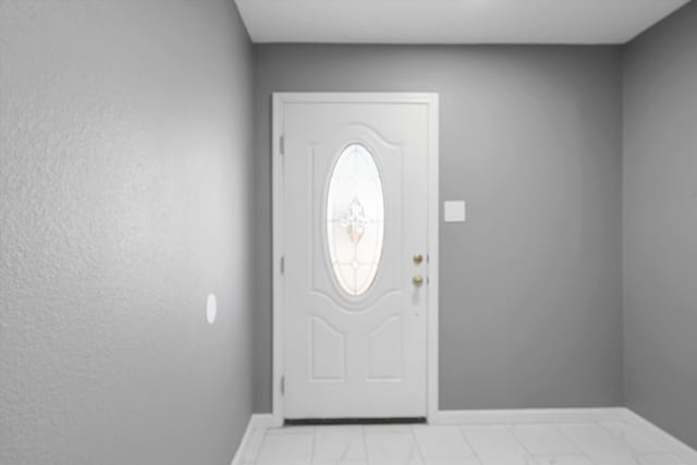 2212 Henry Rd SW, Albuquerque, NM 87105 - foyer with baseboards and light marble finish floors