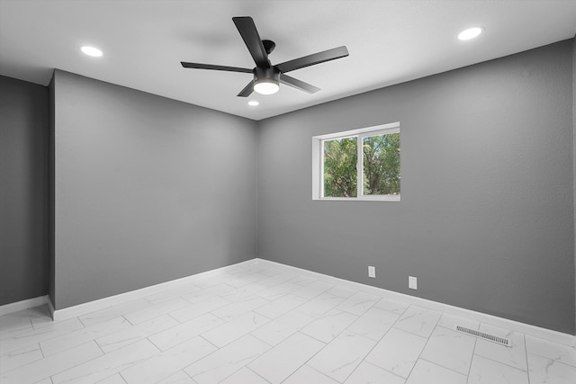 2212 Henry Rd SW, Albuquerque, NM 87105 - spare room with marble look tile flooring, ceiling fan, recessed lighting, and baseboards