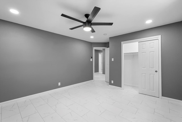 2212 Henry Rd SW, Albuquerque, NM 87105 - unfurnished bedroom with baseboards, light marble finish floors, recessed lighting, a closet, and a ceiling fan