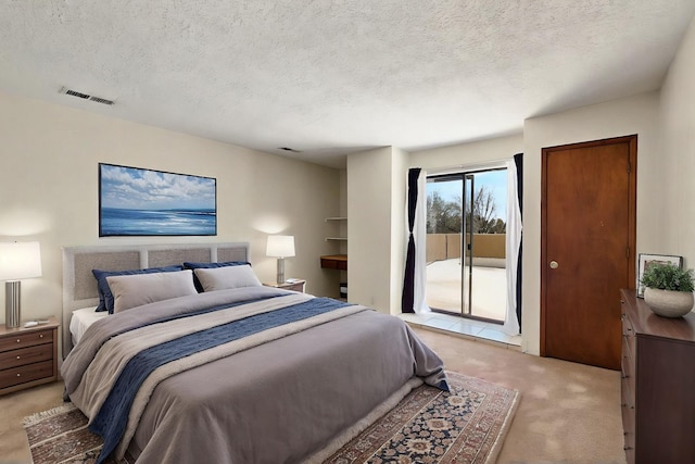3039 Prenda De Oro Dr NW, Albuquerque, NM 87120 - bedroom with light carpet, access to exterior, and a textured ceiling