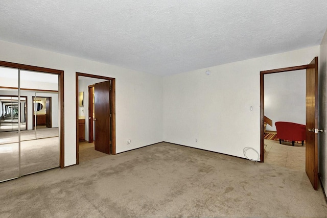 3039 Prenda De Oro Dr NW, Albuquerque, NM 87120 - unfurnished bedroom with carpet floors and a textured ceiling