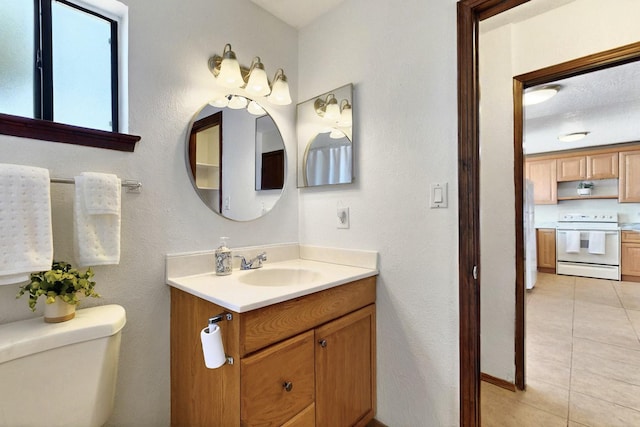 3039 Prenda De Oro Dr NW, Albuquerque, NM 87120 - bathroom with vanity, tile patterned flooring, and toilet
