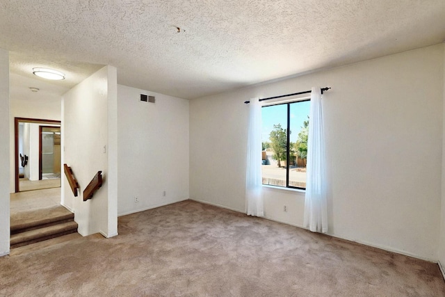 3039 Prenda De Oro Dr NW, Albuquerque, NM 87120 - carpeted spare room with a textured ceiling