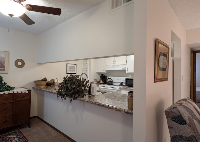 3501 Juan Tabo Blvd NE Unit K9, Albuquerque, NM 87111 - kitchen with electric range, a ceiling fan, carpet, a textured ceiling, and white cabinetry
