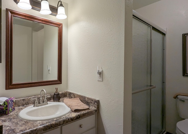 3501 Juan Tabo Blvd NE Unit K9, Albuquerque, NM 87111 - full bathroom featuring toilet, a shower stall, and vanity